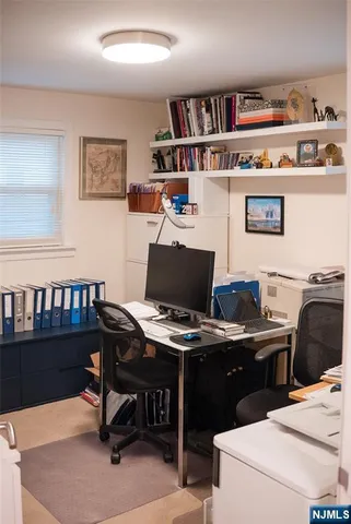 a view of a workspace with furniture