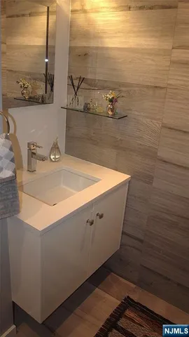 a bathroom with a sink and a mirror