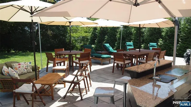 a view of an outdoor sitting area with furniture