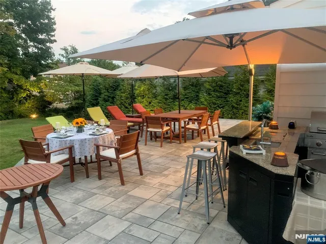an outdoor space with furniture and umbrella