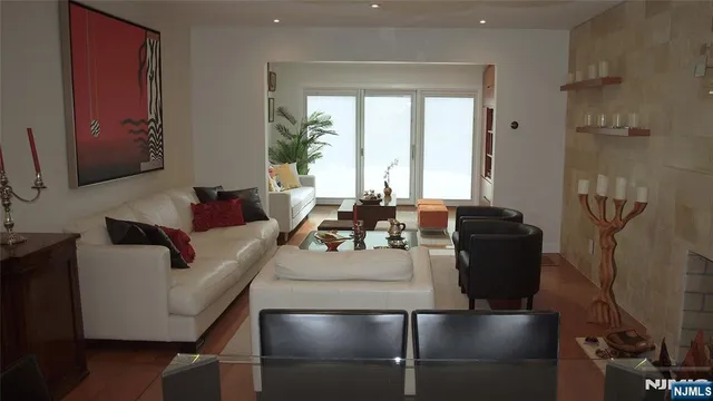 a living room with furniture and a large window