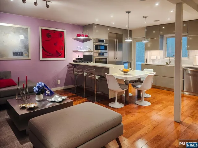 a dining room with a table and chairs