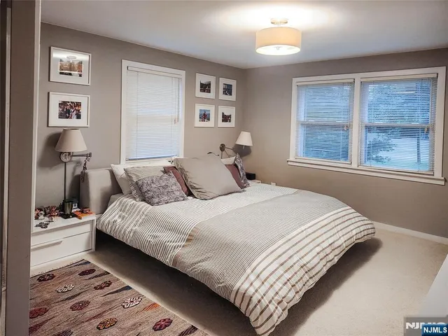 a bedroom with bed and window