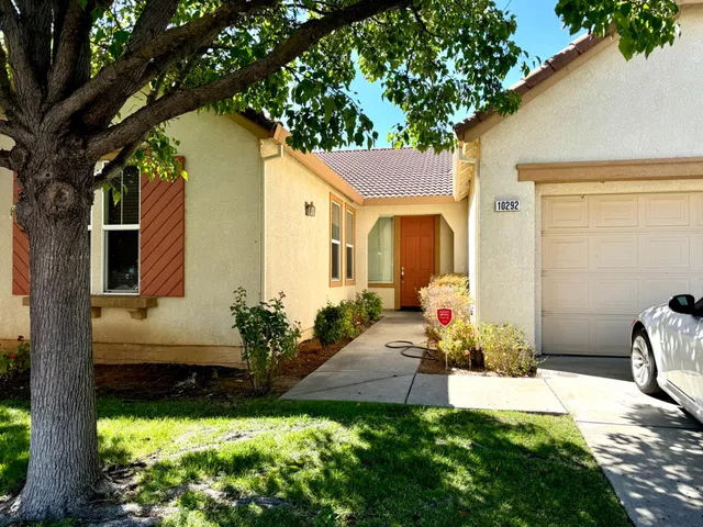 a front view of a house with yard