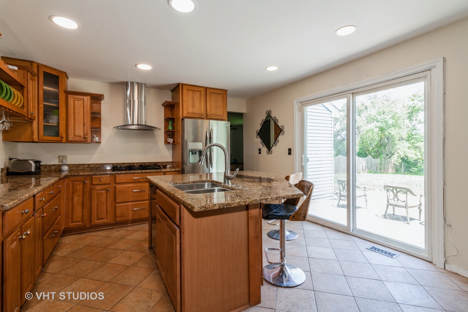 3523 Ronald Road Crete, IL 60417 - Photo 7 of 20 a kitchen with kitchen island granite countertop a sink a counter top space and stainless steel appliances
