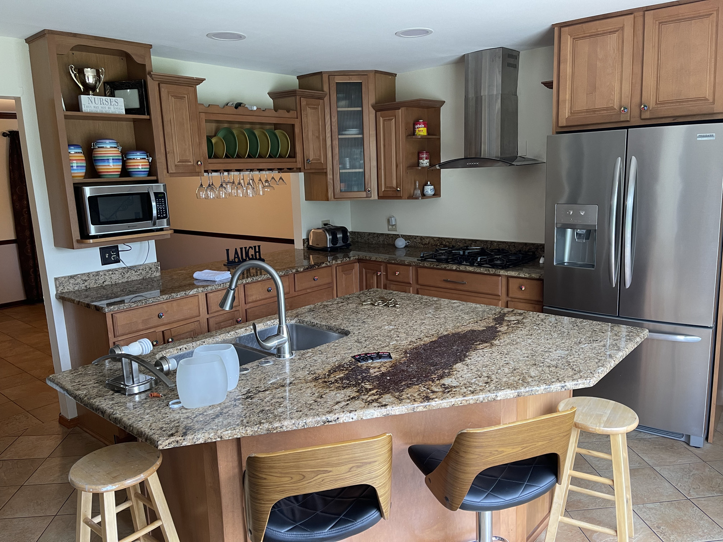 3523 Ronald Road Crete, IL 60417 - Photo 9 of 20 a kitchen with cabinets and chairs