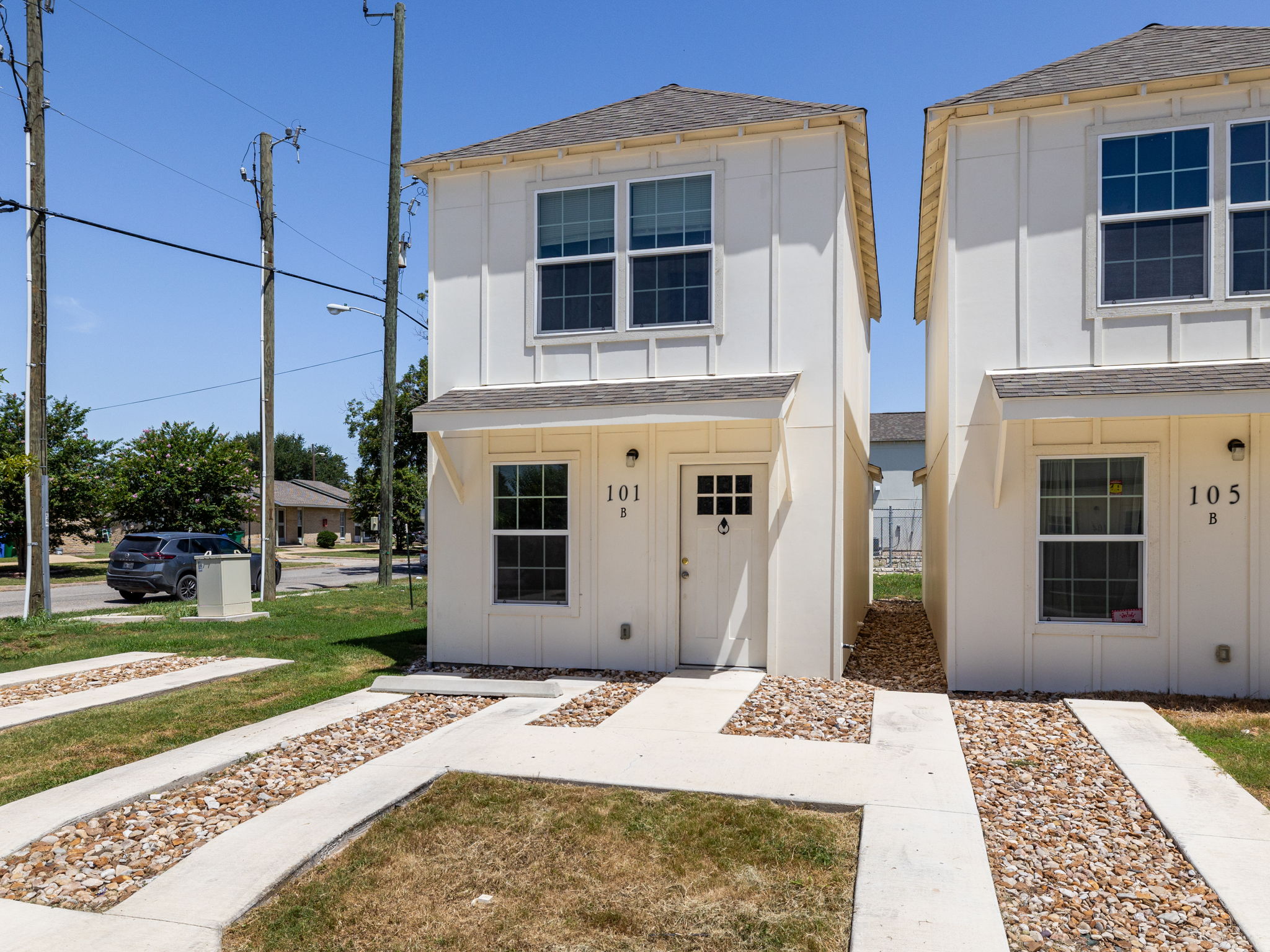 230 Debus Drive, Unit 101B Taylor, TX 76574 - Photo 2 of 15 a view of a house with a yard