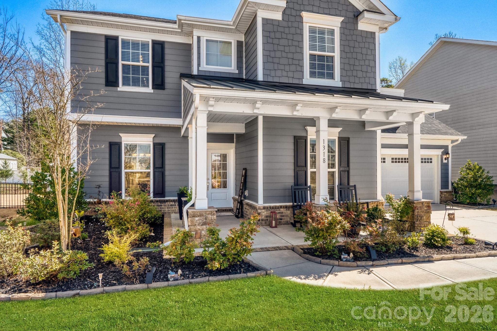 front view of a house with a yard