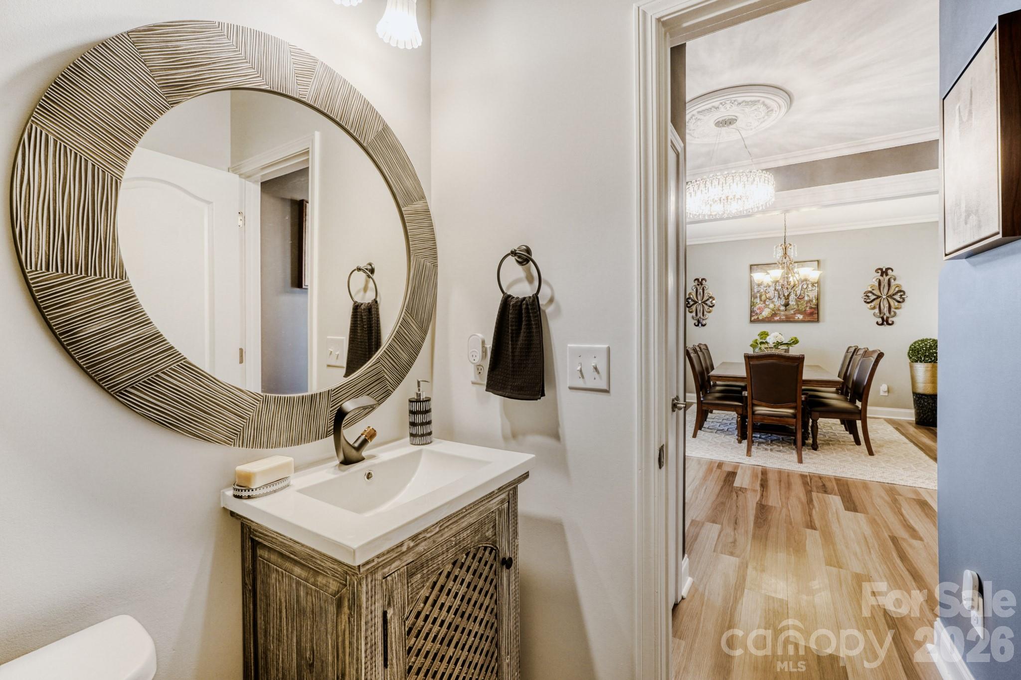1318 Poppy Way Matthews, NC 28104 - Photo 15 of 33 a bathroom with a sink and mirror
