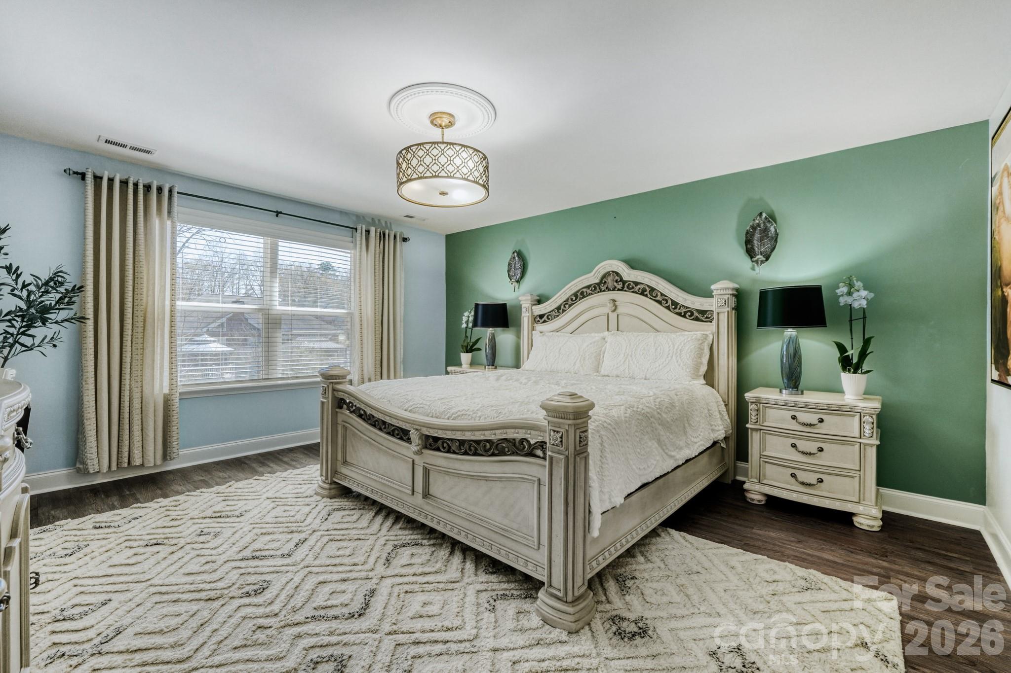 1318 Poppy Way Matthews, NC 28104 - Photo 16 of 33 a bedroom with a bed and a window