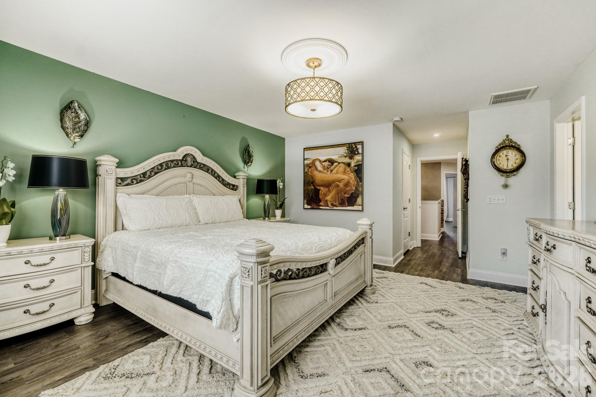 1318 Poppy Way Matthews, NC 28104 - Photo 17 of 33 a bedroom with a bed and closet with mirror