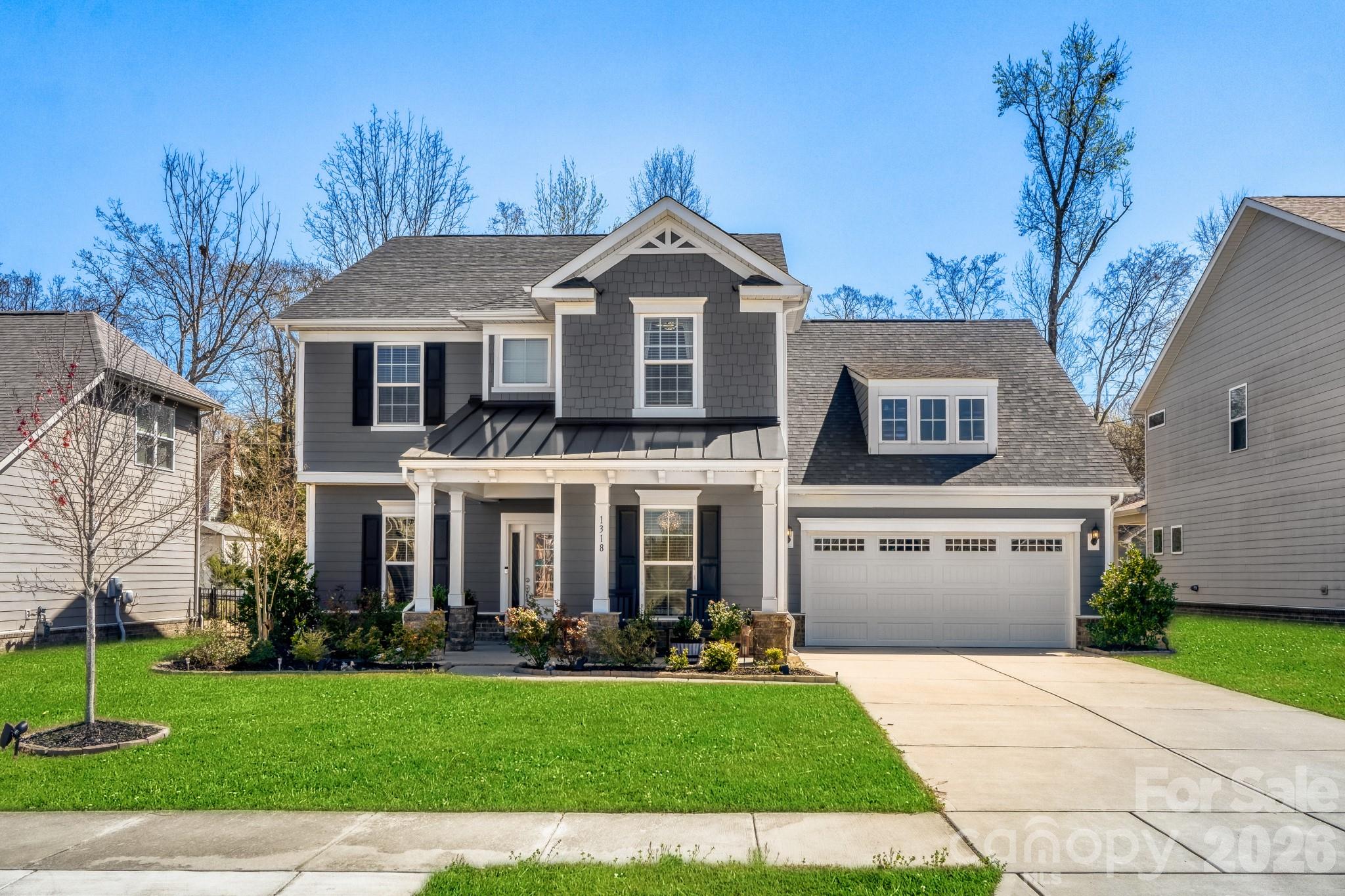 1318 Poppy Way Matthews, NC 28104 - Photo 2 of 33 a front view of a house with a yard
