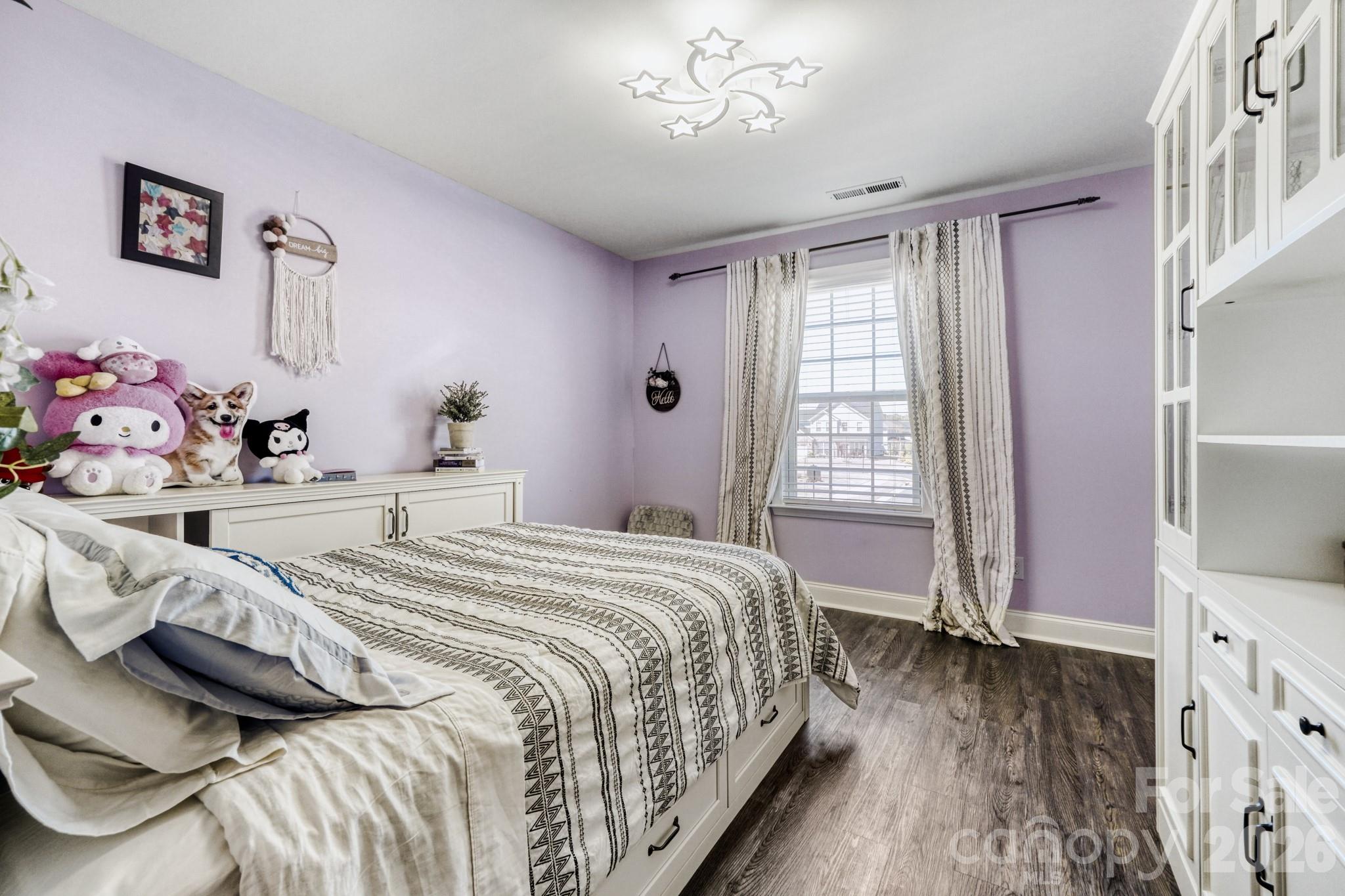 1318 Poppy Way Matthews, NC 28104 - Photo 21 of 33 a bedroom with a bed and a window