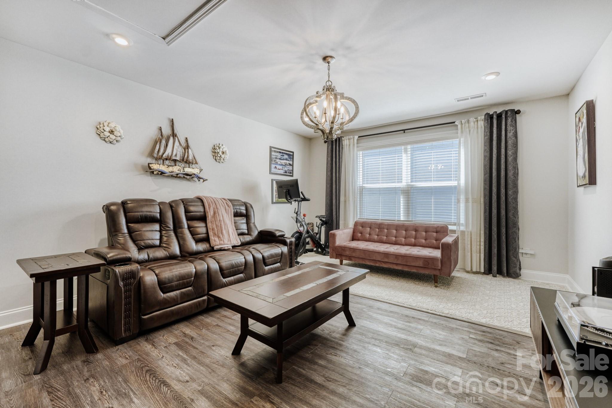 1318 Poppy Way Matthews, NC 28104 - Photo 24 of 33 a living room with fireplace furniture and a window