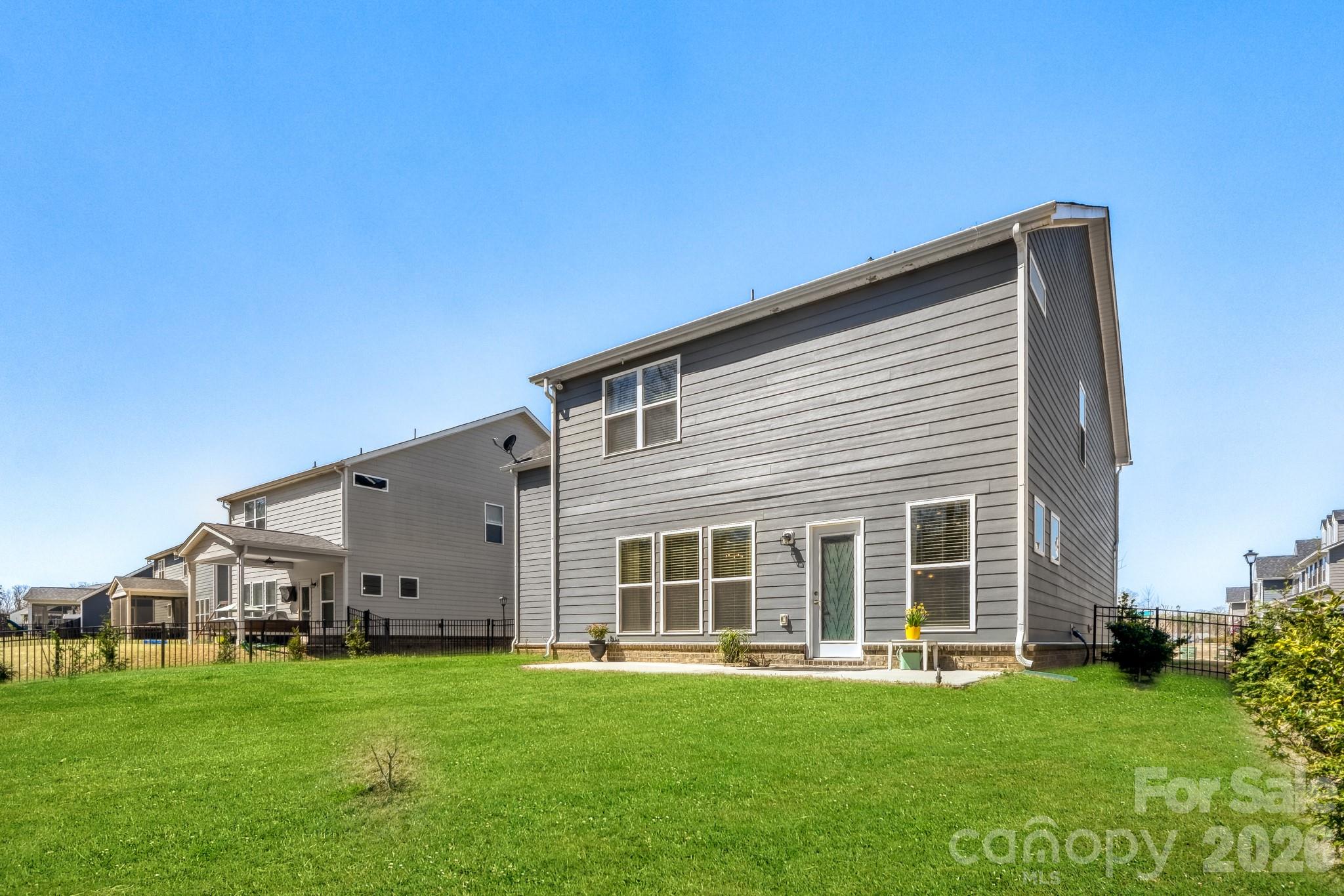 1318 Poppy Way Matthews, NC 28104 - Photo 28 of 33 a view of a house with a backyard