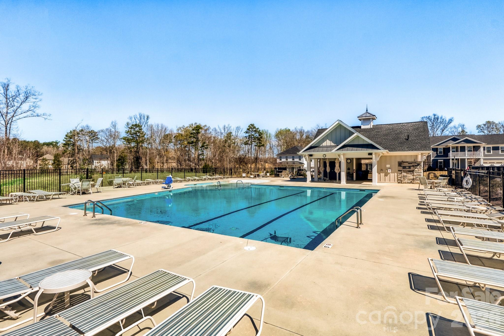1318 Poppy Way Matthews, NC 28104 - Photo 33 of 33 a view of a white house with a yard and sitting area