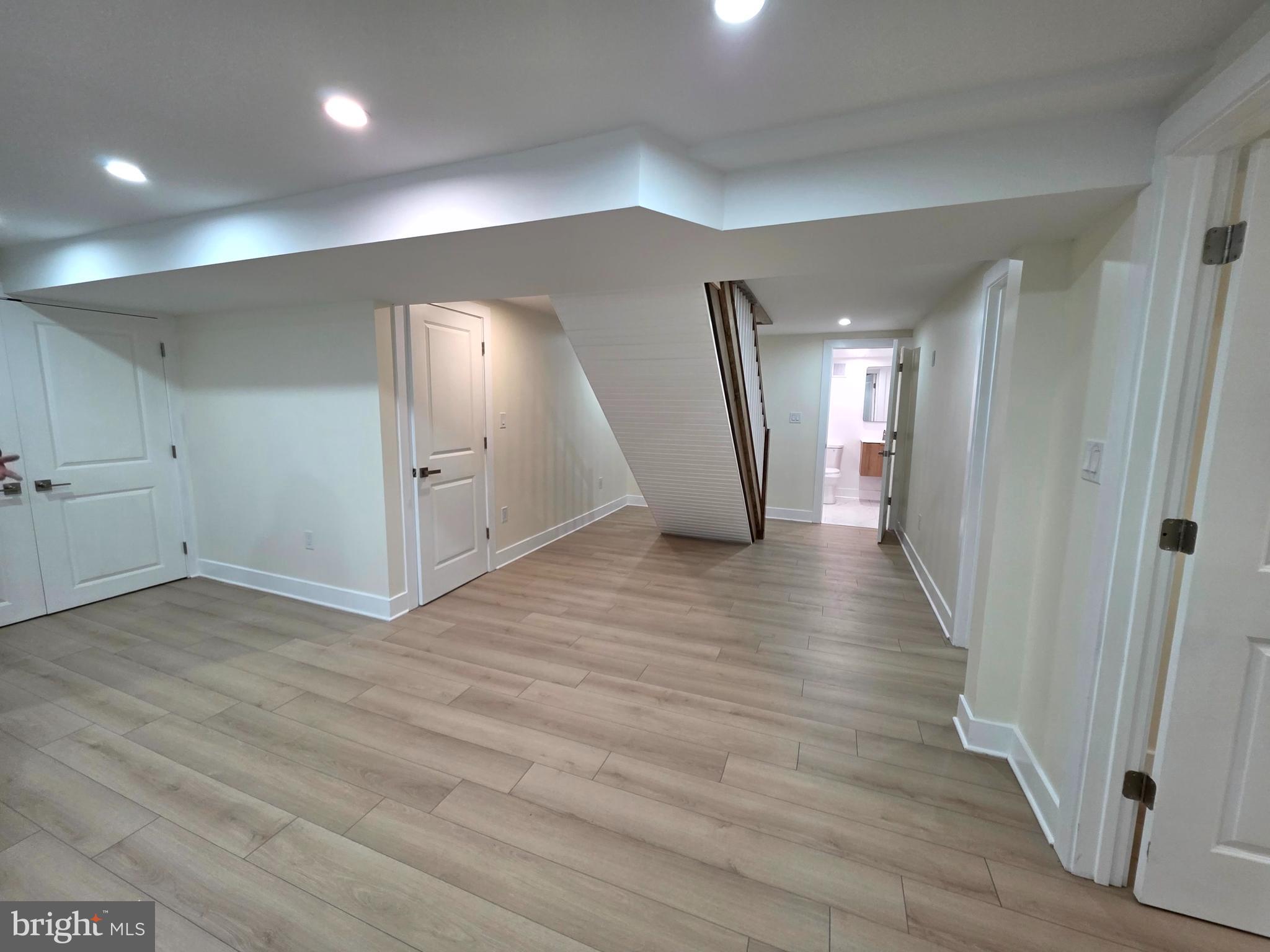 2206 Brinkley Road Fort Washington, MD 20744 - Photo 51 of 78 a view of a hallway with wooden floor