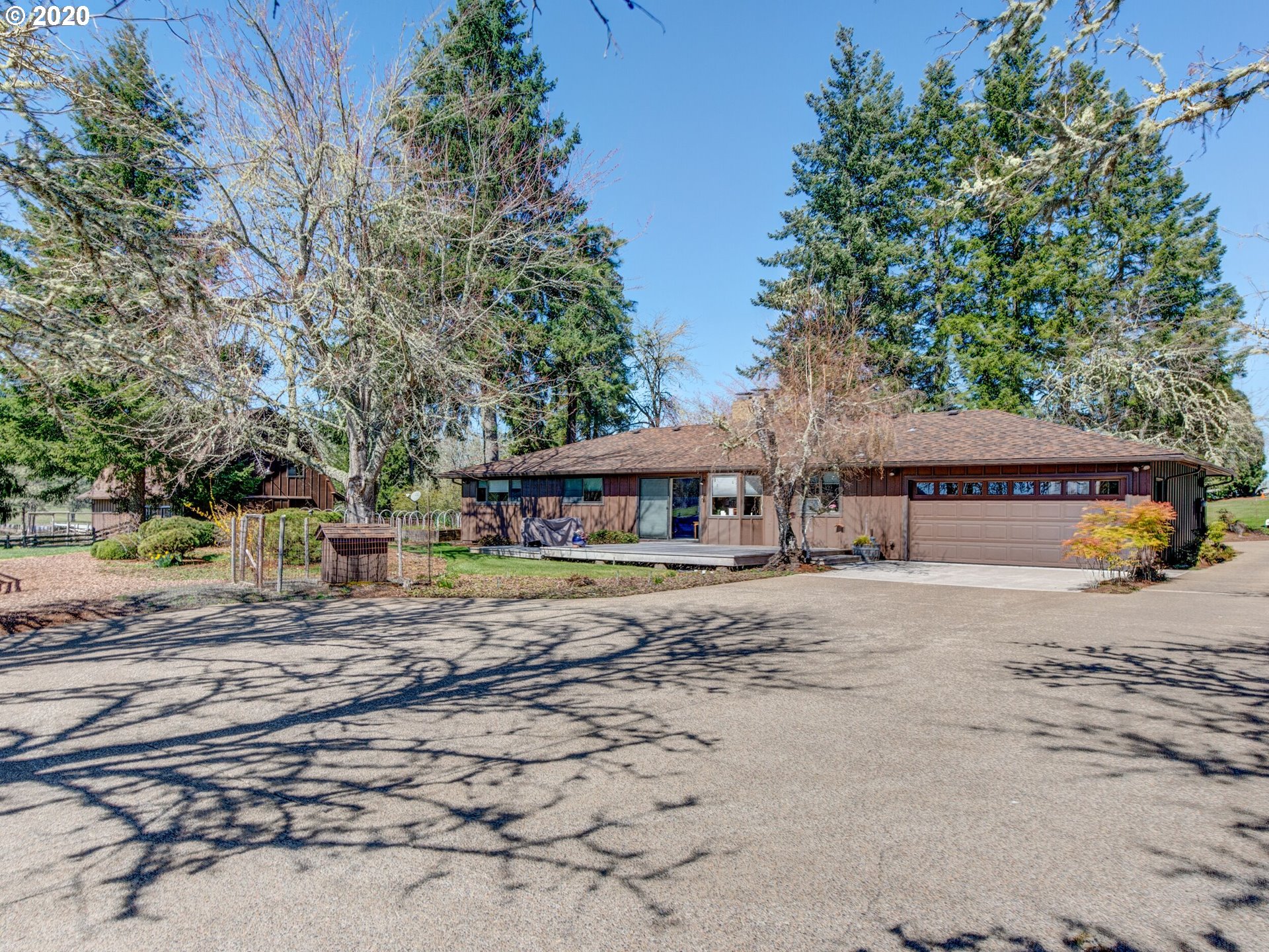28784 Summerville Road Eugene, OR 97405 - Photo 9 of 26 a house with trees in front of it