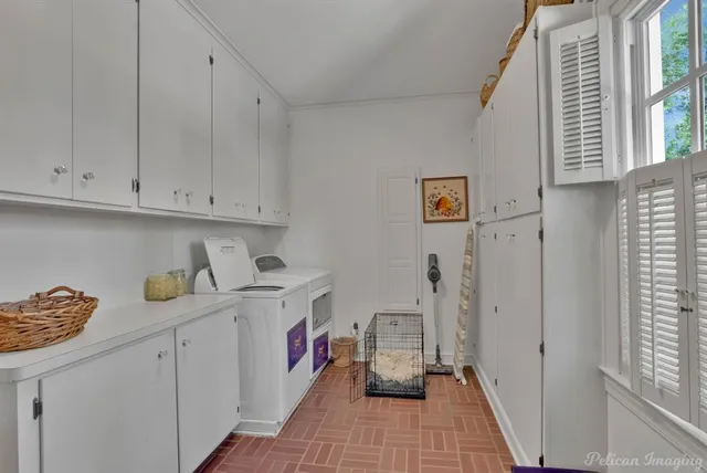 a kitchen with cabinets and window