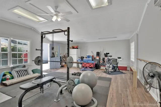 a room with gym equipment and a large window