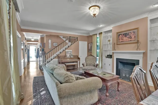 a living room with furniture and a fireplace