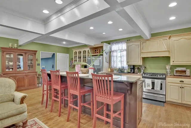 a large kitchen with a table and chairs