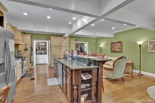 a view of a dining area with furniture and a large window