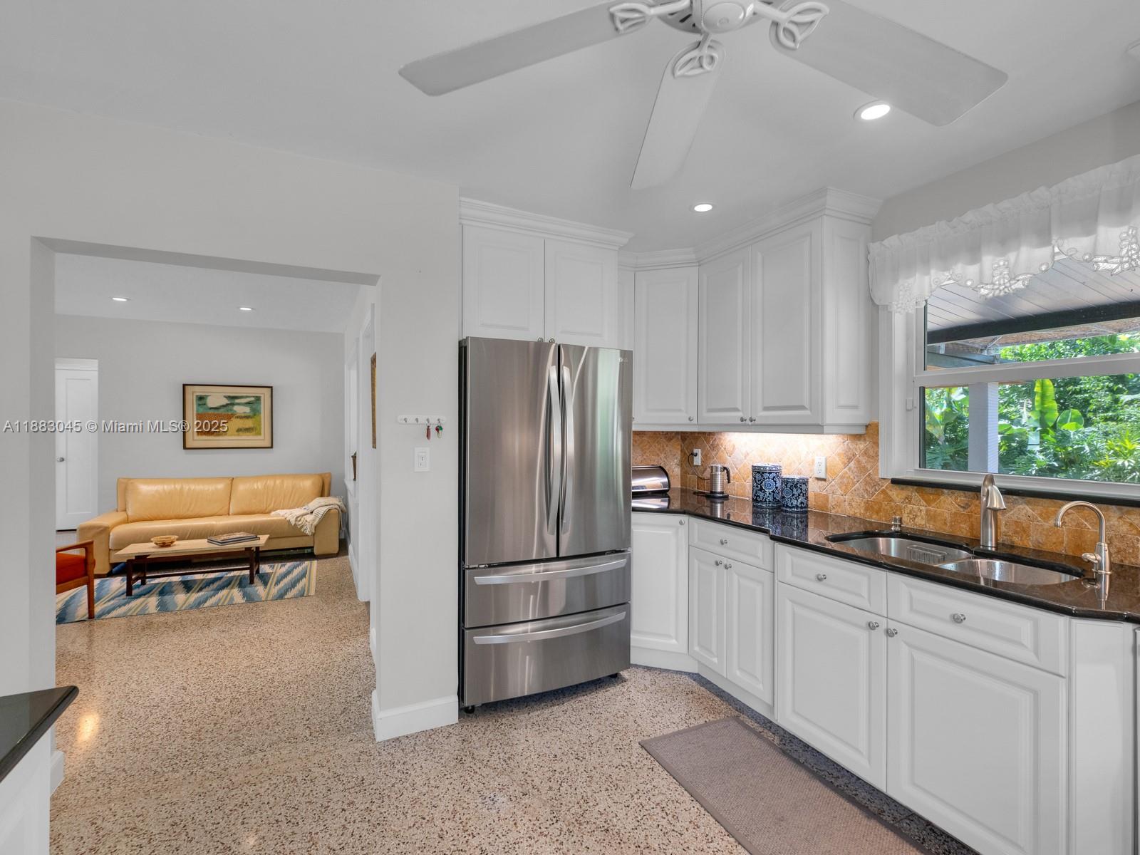 230 Beverly Road West Palm Beach, FL 33405 - Photo 24 of 47 a kitchen with granite countertop a refrigerator and a sink