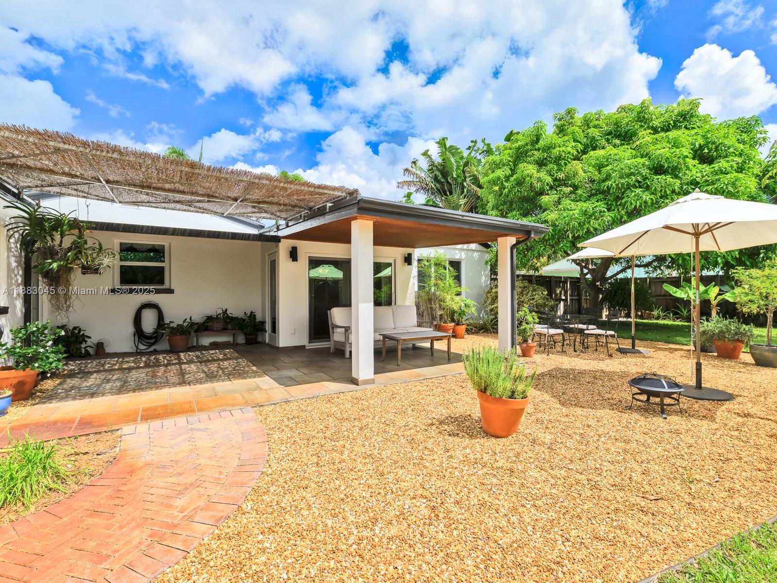 230 Beverly Road West Palm Beach, FL 33405 - Photo 32 of 47 a view of a backyard with plants and patio
