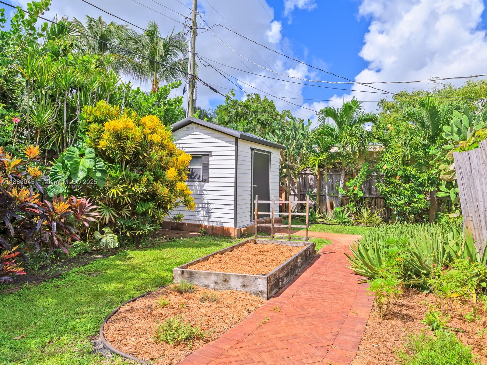 230 Beverly Road West Palm Beach, FL 33405 - Photo 35 of 47 a view of a backyard with a garden