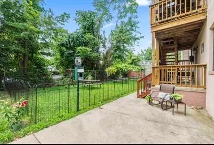 a view of a lake with a bench in a garden