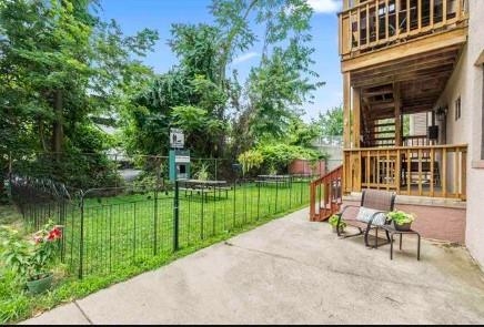 211-213 Prospect Avenue Bayonne, NJ 07002 - Photo 13 of 16 a view of a lake with a bench in a garden
