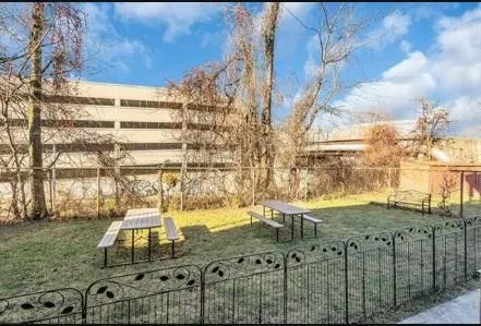 a view of houses with a yard