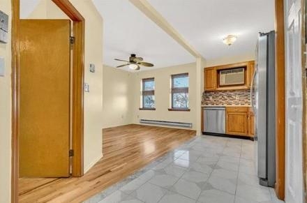 211-213 Prospect Avenue Bayonne, NJ 07002 - Photo 8 of 16 a view of a kitchen with a sink and dishwasher cabinet