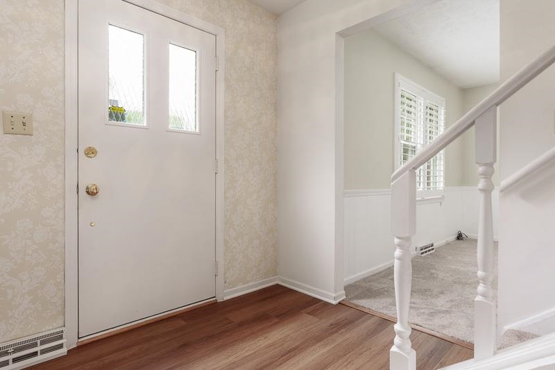5792 Haddon Place Rockford, IL 61114 - Photo 3 of 47 a view of entryway with wooden floor and stairs