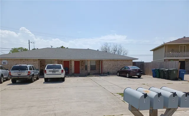 a view of a car parked in front of a house