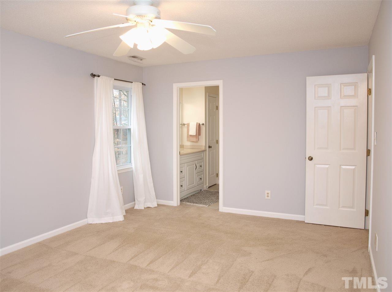 1117 Toppe Ridge Court Raleigh, NC 27615 - Photo 15 of 30 an empty room with fan and entrance