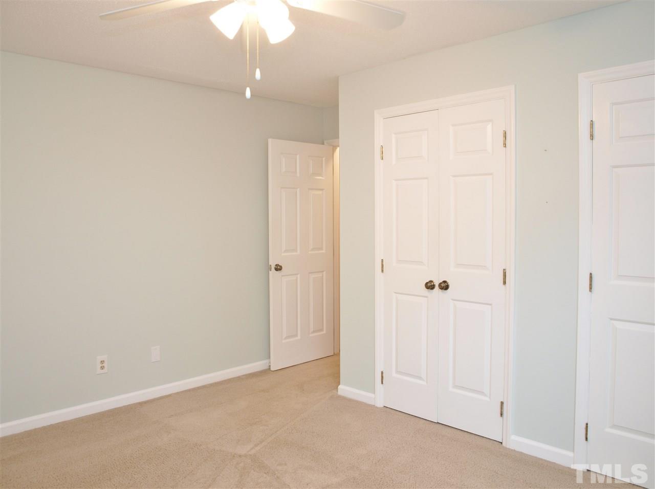 1117 Toppe Ridge Court Raleigh, NC 27615 - Photo 20 of 30 an empty room with a ceiling fan