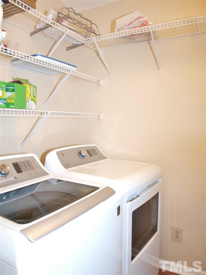 1117 Toppe Ridge Court Raleigh, NC 27615 - Photo 22 of 30 a utility room with dryer and washer