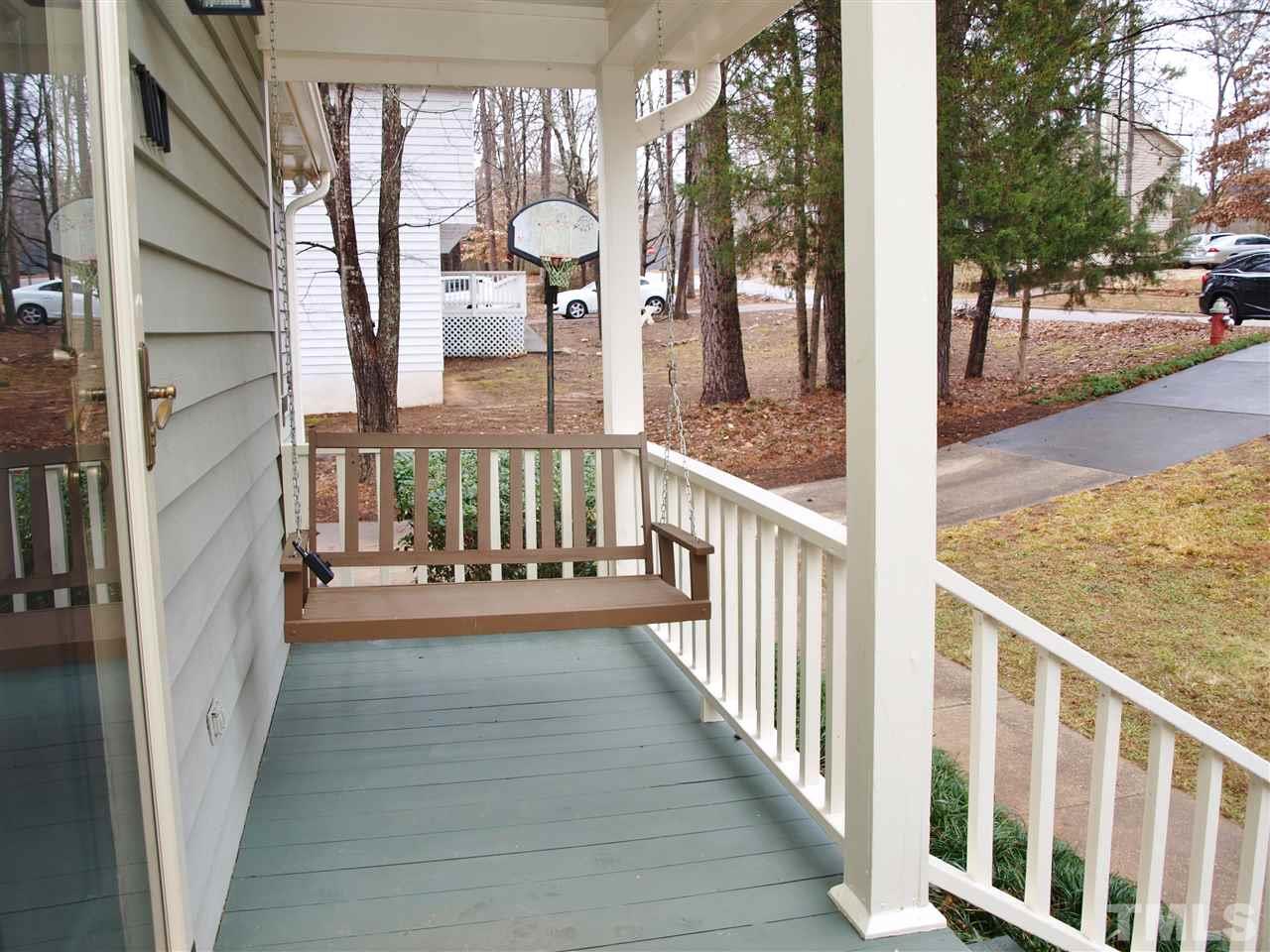 1117 Toppe Ridge Court Raleigh, NC 27615 - Photo 24 of 30 a view of a porch with wooden floor and iron stairs