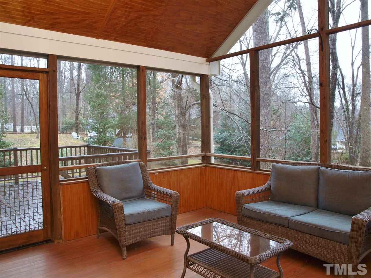 1117 Toppe Ridge Court Raleigh, NC 27615 - Photo 25 of 30 a living room with furniture and a floor to ceiling window