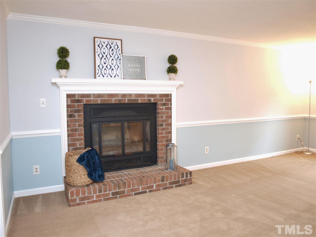 1117 Toppe Ridge Court Raleigh, NC 27615 - Photo 8 of 30 a living room with a fireplace