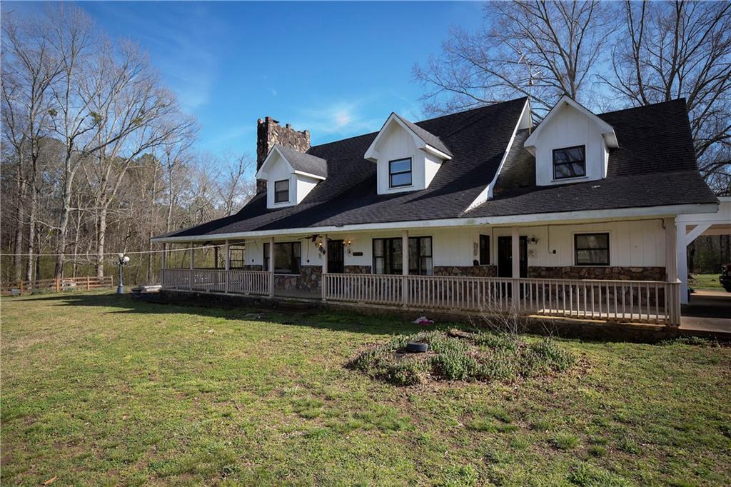 806 Fairview Road Northwest Calhoun, GA 30701 - Photo 1 of 1 a front view of a house with a garden