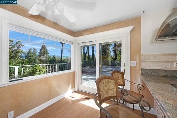 a view of a dining room with furniture window and outside view