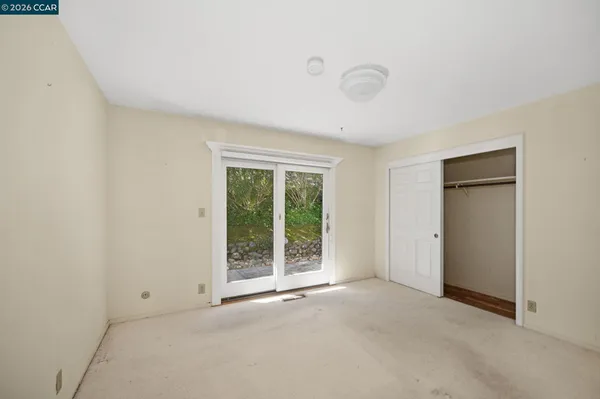 a view of an empty room with a window