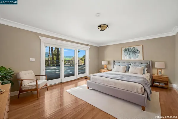 a spacious bedroom with a bed and a large window