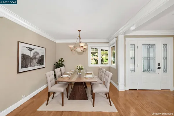 a view of a dining room with furniture and wooden floor