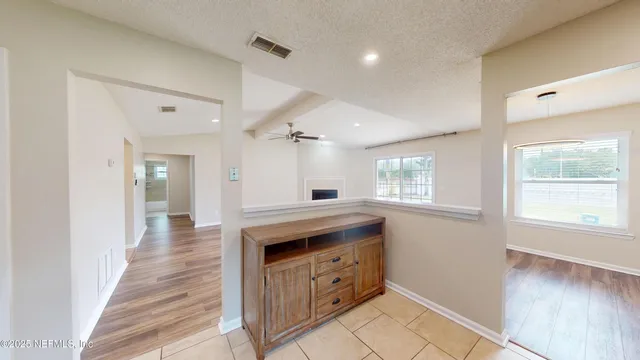 a kitchen with granite countertop a stove and a sink