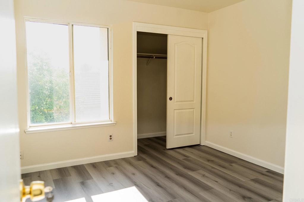 3005 Litt Road Modesto, CA 95355 - Photo 37 of 53 an empty room with wooden floor and windows