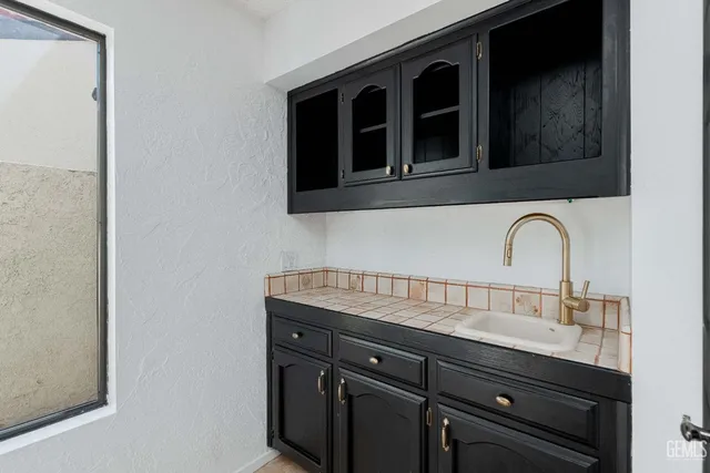 a close view of a sink and a microwave in a kitchen